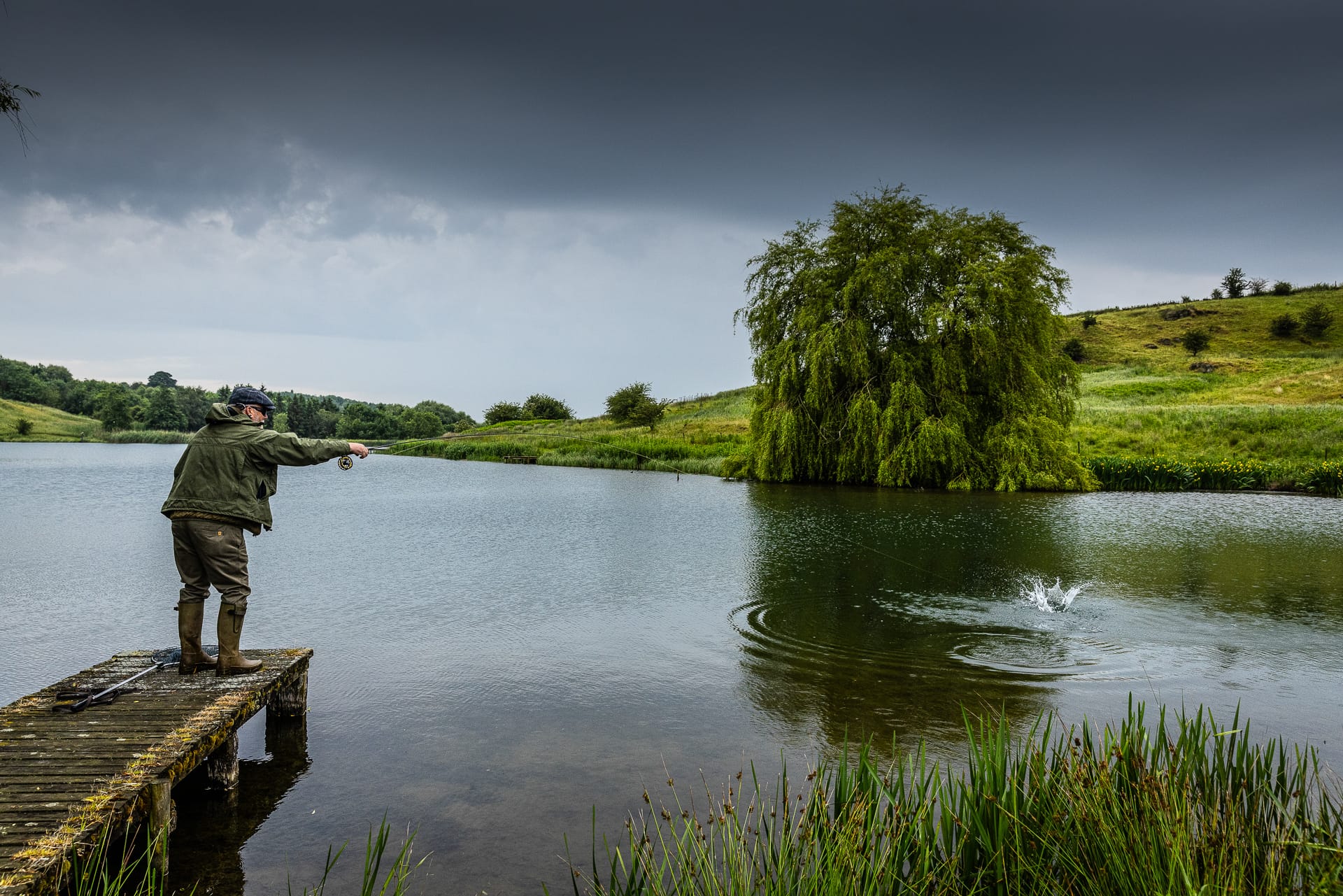 Casting a line into the lake before the heavens open.