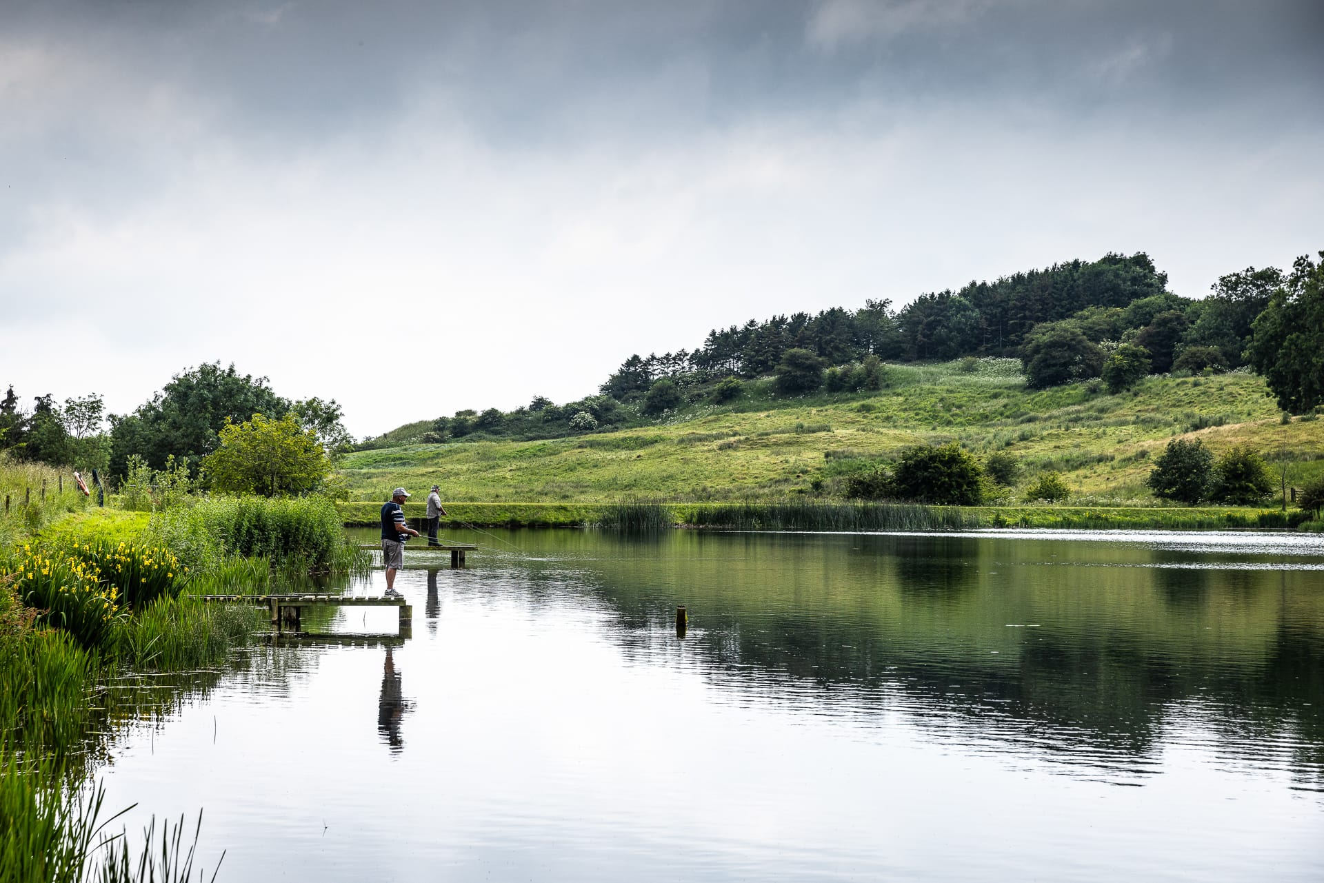 Otby lake being fished from multiple fishing docks
