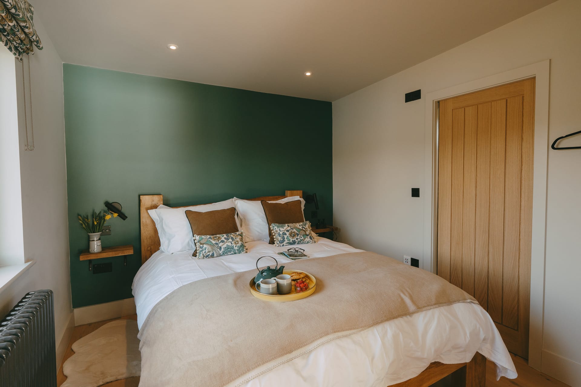 The Otby Boat House bedroom with tea tray made up in the middle of the bed
