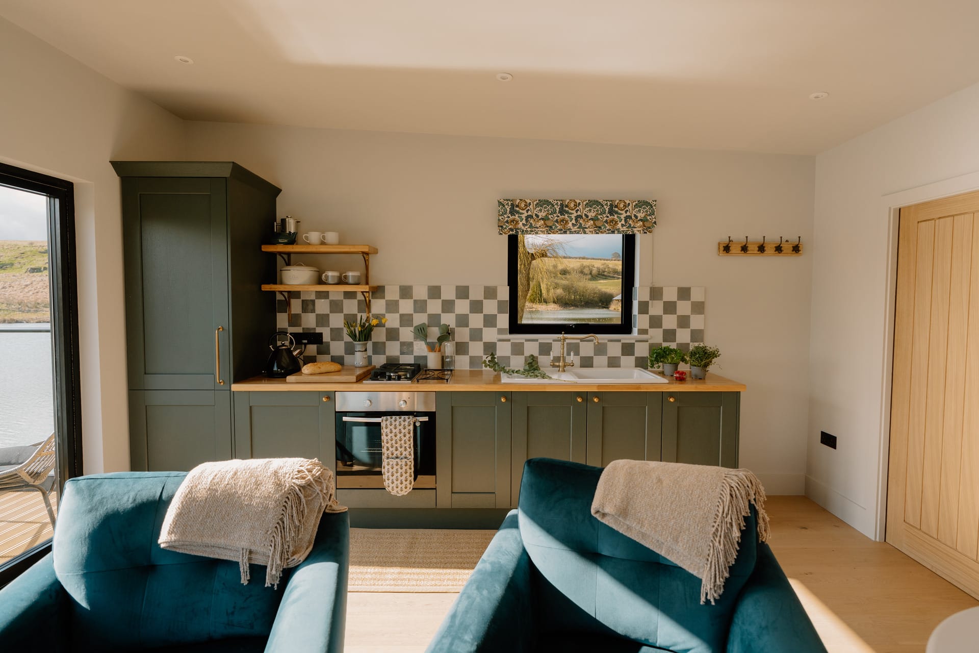 The Otby Boat House kitchen with a stunning view through the kitchen window