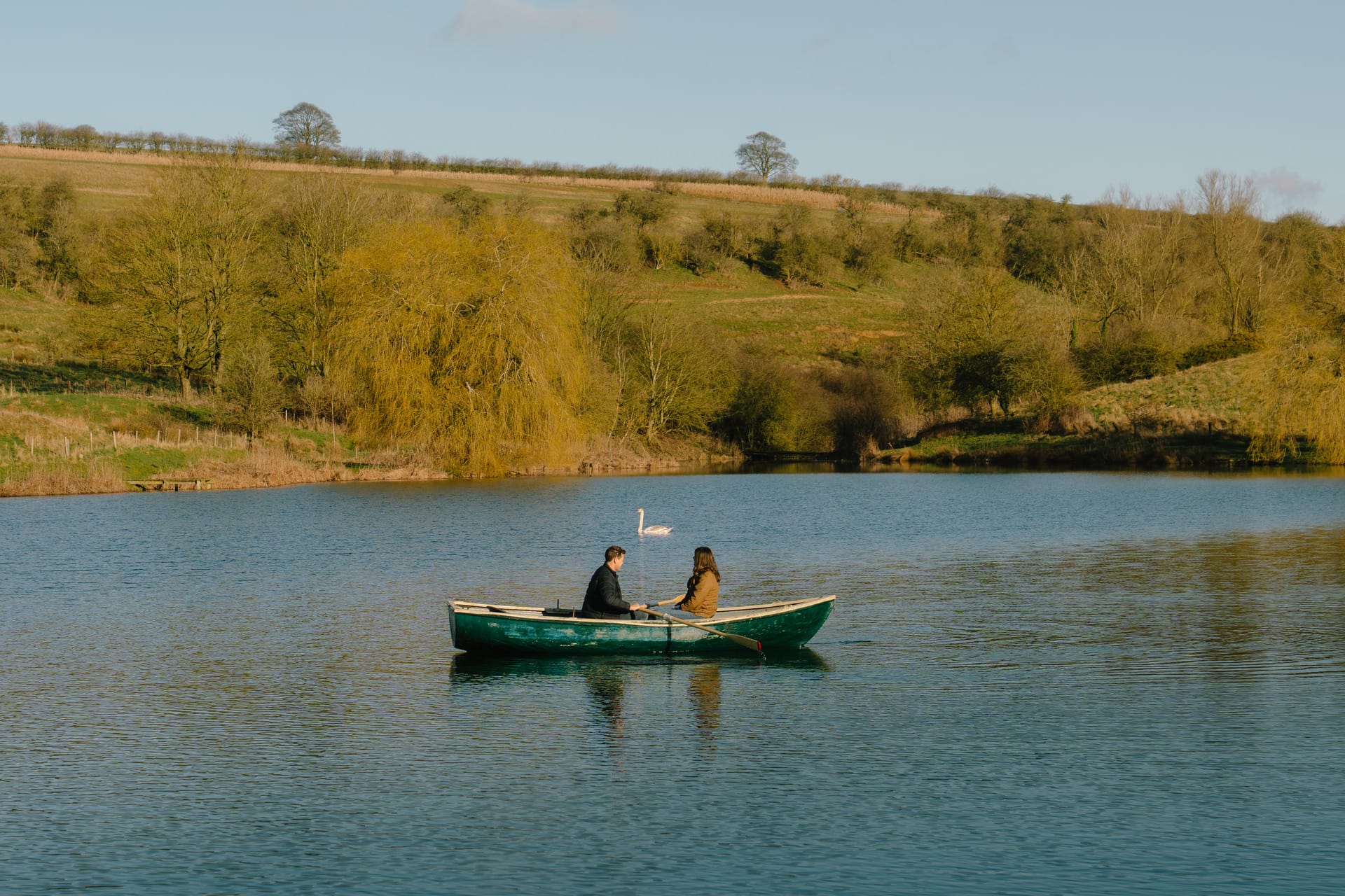 Couple rowing in the centre of the Otby Lake
