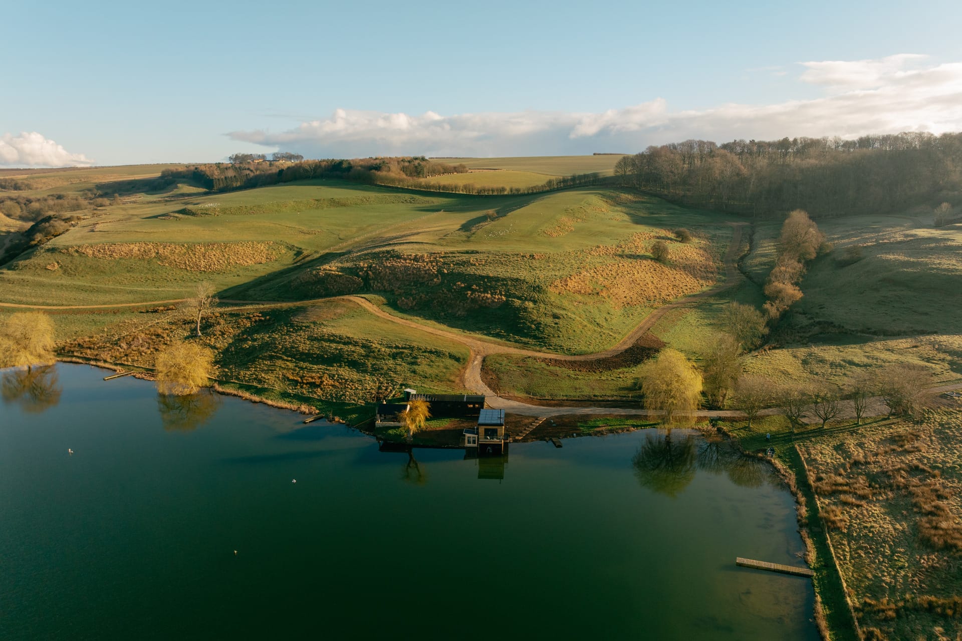 Otby Boat House aerial view with rolling hills as the backdrop