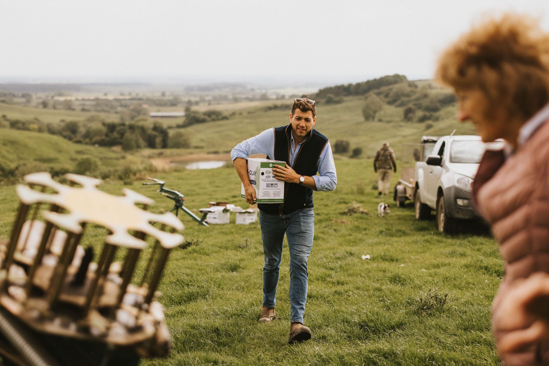 Frank bringing a box of clay pigeon to the automatic clay trap