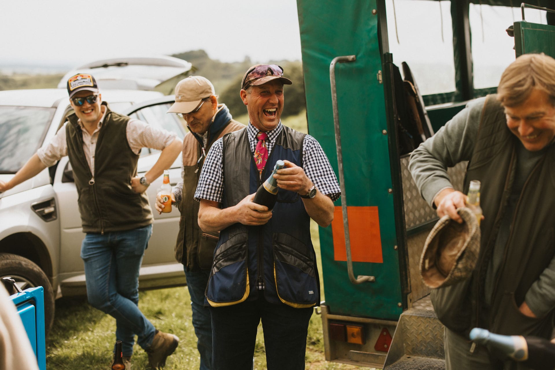 Group of people enjoying a bottle of prosecco after a shoot
