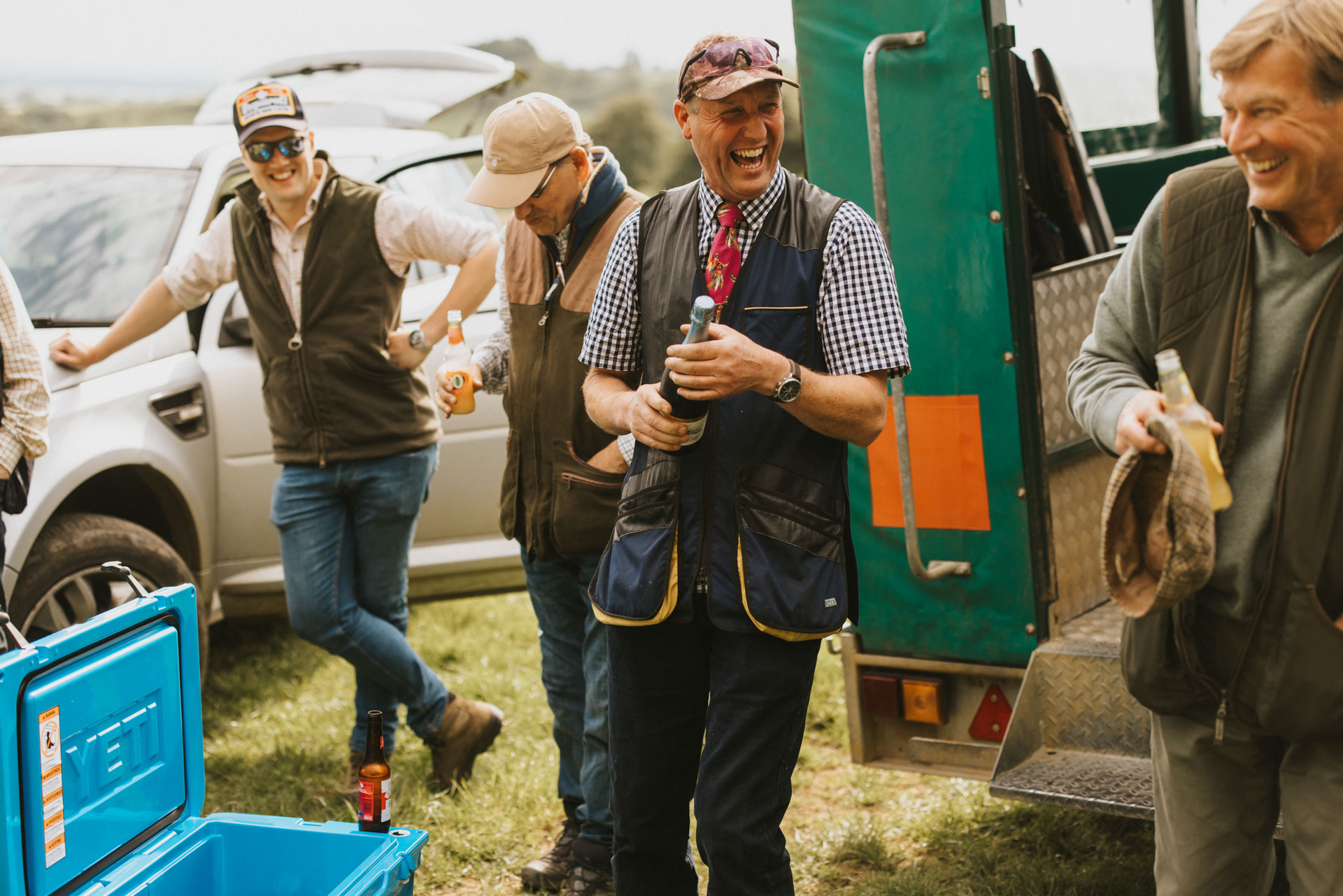 Group of people enjoying a bottle of prosecco after a shoot